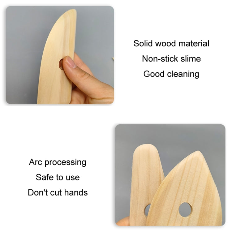 Wooden pottery scraper pressed by hand against clay, solid light wood tool