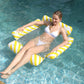 Yellow and white striped 4-tube inflatable floating hammock, reclining in pool