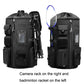 Black sport backpack with side racket-style attachment and camera rack on right side