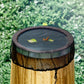 Round insect screen cover with mesh top and elastic edge over a wooden bucket