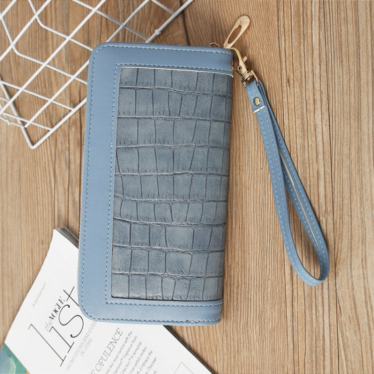 Light blue crocodile-embossed long wallet with zip closure and wrist strap