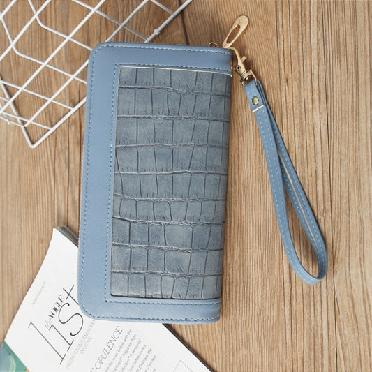 Light blue crocodile-embossed long wallet with zip closure and wrist strap