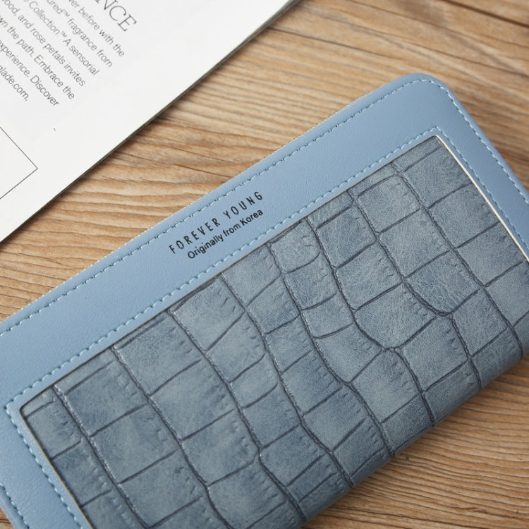 Light blue croc-embossed wallet front with stitched border and small logo patch