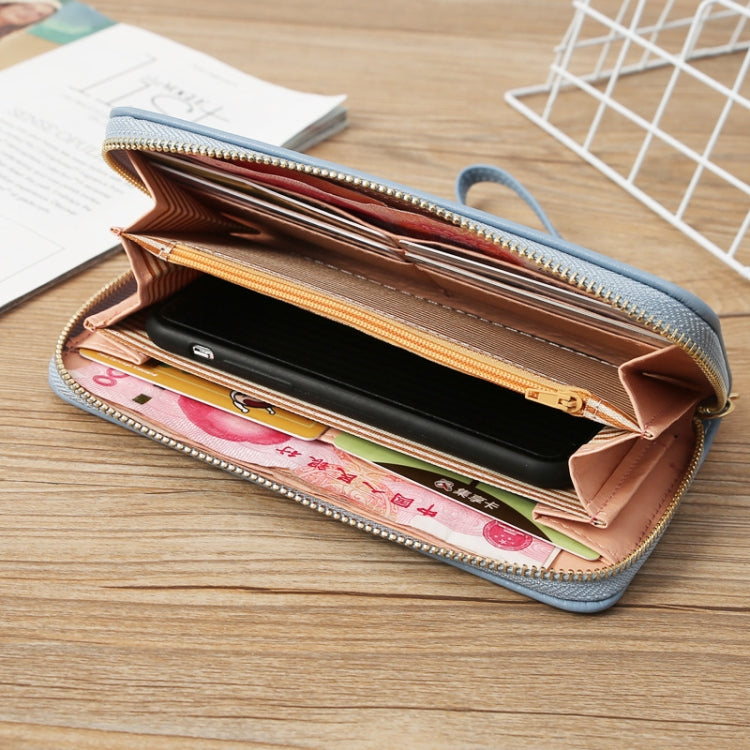 Light blue wallet open view showing card slots and a secure inner zip pocket