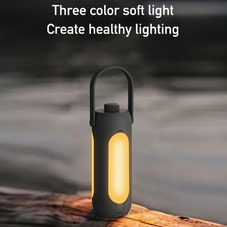 Black camping lantern with warm glowing light window