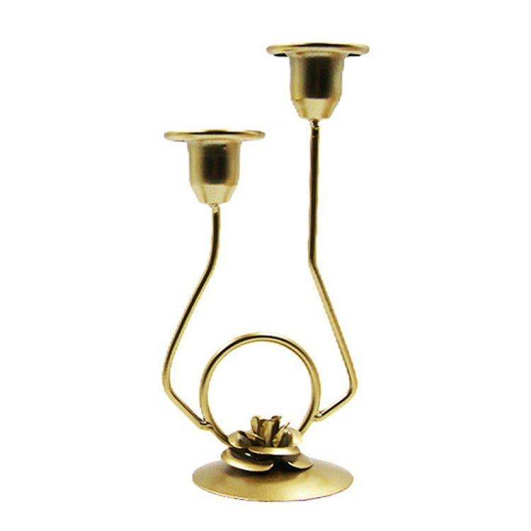 Gold-tone double-headed candle holder with white flower and loop handle