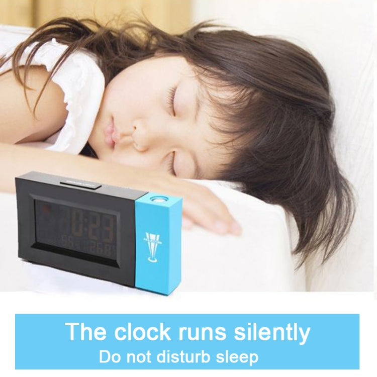 Digital weather clock on nightstand with color display and projection box
