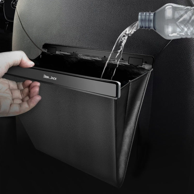Black rear seat trash storage bag with open top as water pours in