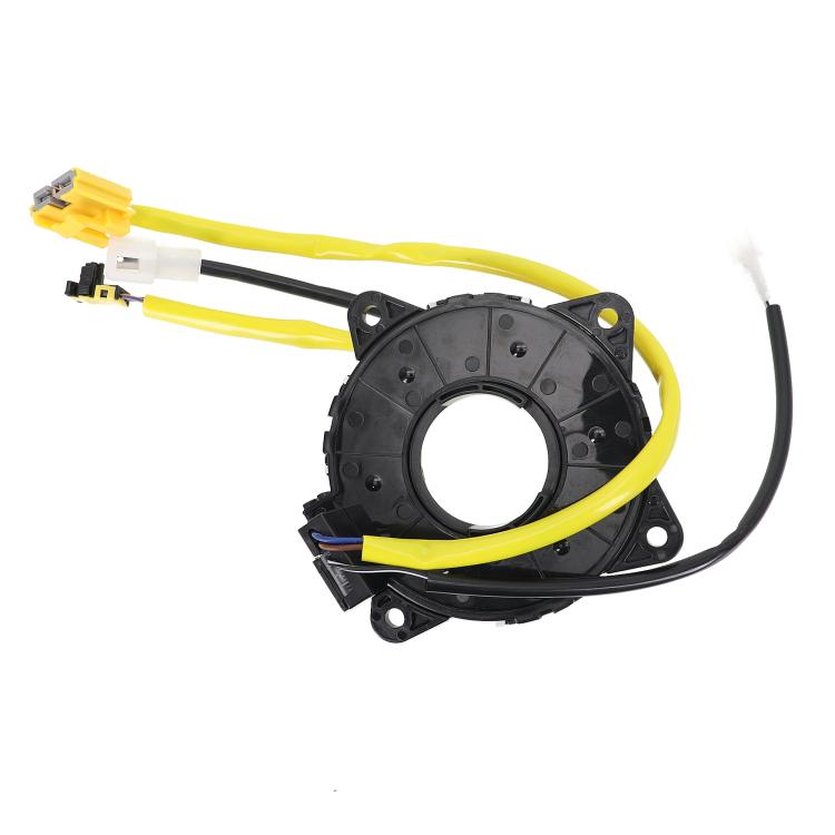 Clock spring coil assembly with black housing, yellow wire leads, and electrical connectors
