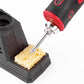 Soldering iron tip heating a yellow sponge on the charging base