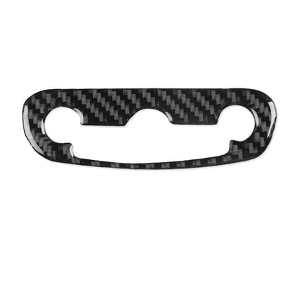 Black carbon-fiber headlight switch sticker with three cutouts