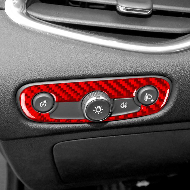 Red carbon-fiber headlight switch sticker applied around control knobs