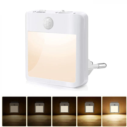 Motion sensor LED night light with warm glow panel and built-in daylight sensor