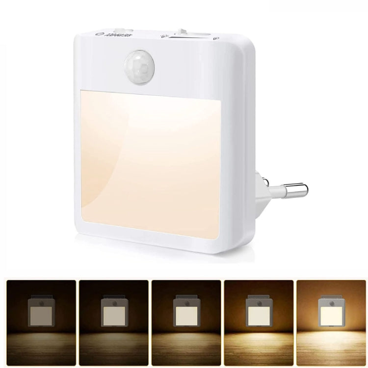 Plug-in motion sensor LED night light with warm light diffuser panel and socket