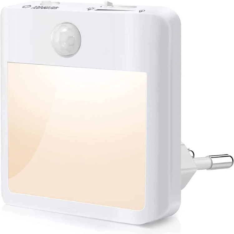 Close-up of white motion sensor LED night light with front diffuser and side plug