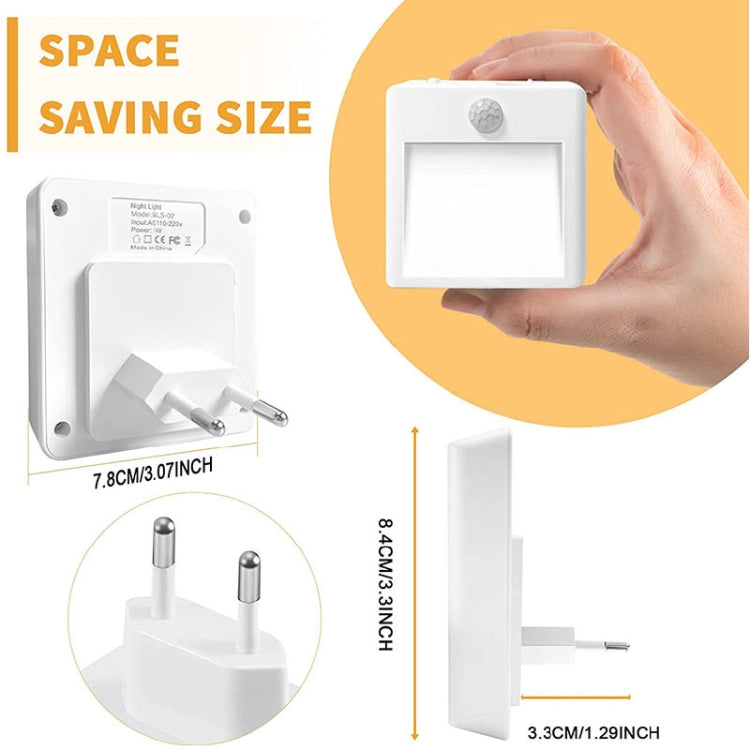 Compact motion sensor LED night light, shown with hand holding the front panel