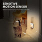 Motion-sensor LED night light wall plug, white housing, emits warm glow