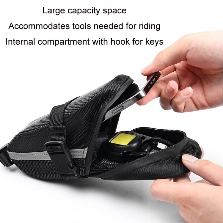 Black saddle tool bag with internal compartment and key hook, open view