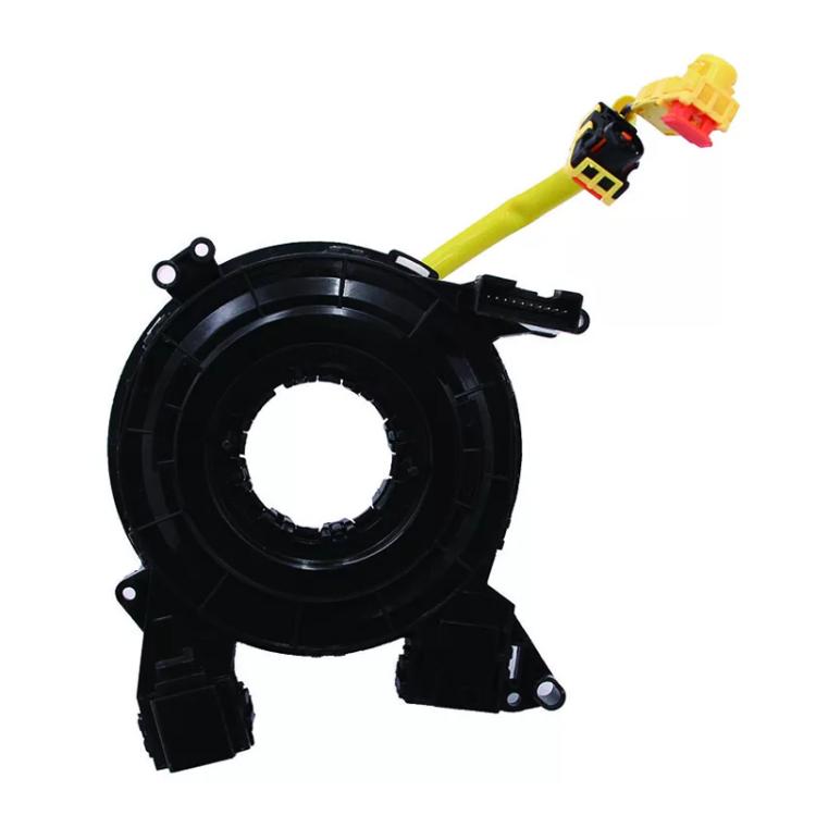 Black clock spring coil assembly with central ring and yellow lead wires