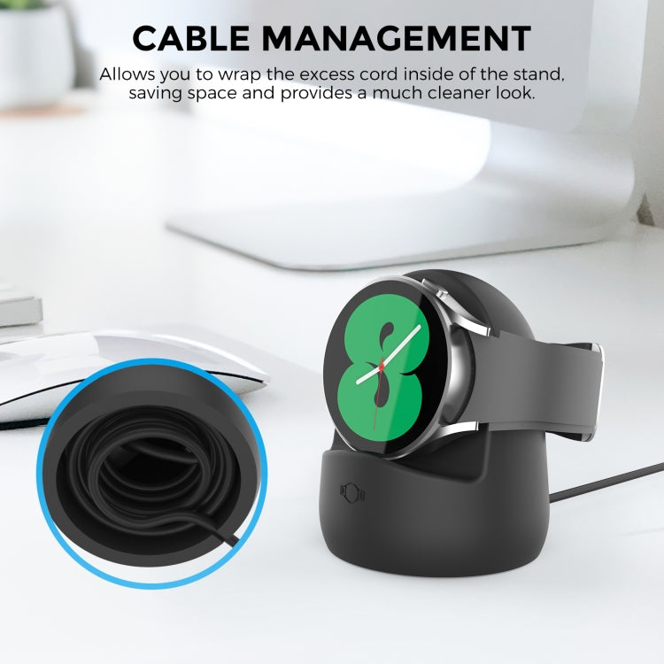 Black silicone charging stand with watch cradle and cable-wrap channel