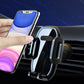 Black car phone holder holding a phone on the air vent clamp