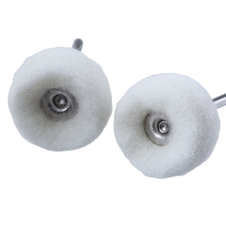 Close-up of two white wool polishing wheels with metal backing plates