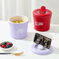 Lavender and red small electric one-piece cookers with lift-up lids and power buttons