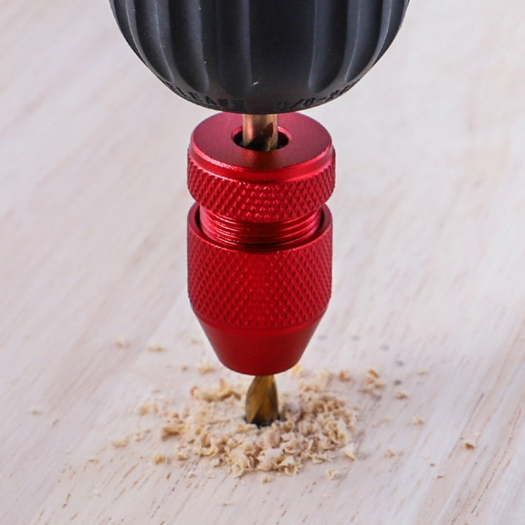 Adjustable red bit stop locator tool with drill bit set at the depth stop