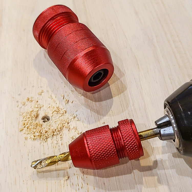Adjustable red bit stop locator with drill bit inserted and metal depth stop collar