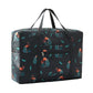 Black flamingo leaf print foldable duffel bag with top handles and front zip pocket