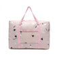 Light pink geometric print foldable duffel bag with top handles and front zip pocket