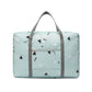 Light blue icon print foldable duffel bag with top handles and front zip pocket