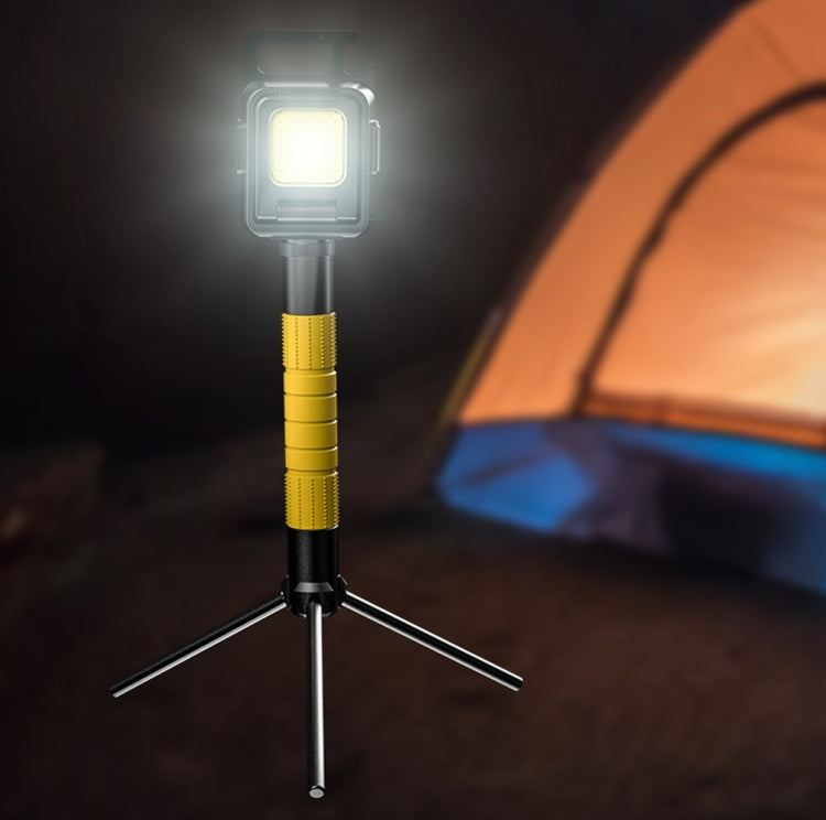 Mini COB keychain flashlight on tripod stand, glowing square LED panel, yellow handle