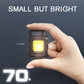 Small black COB keychain flashlight held in hand with one bright LED panel