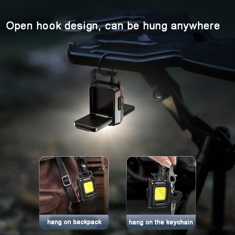 Black COB keychain flashlight hanging from an open hook