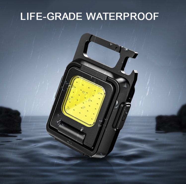 Black mini COB keychain flashlight with yellow LED panel and side button