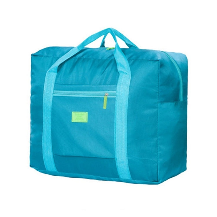 Turquoise portable storage bag with dual handles and front zip pocket for luggage trolley use