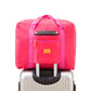 Bright pink trolley storage bag with front zip pocket and top handle for luggage trolley storage