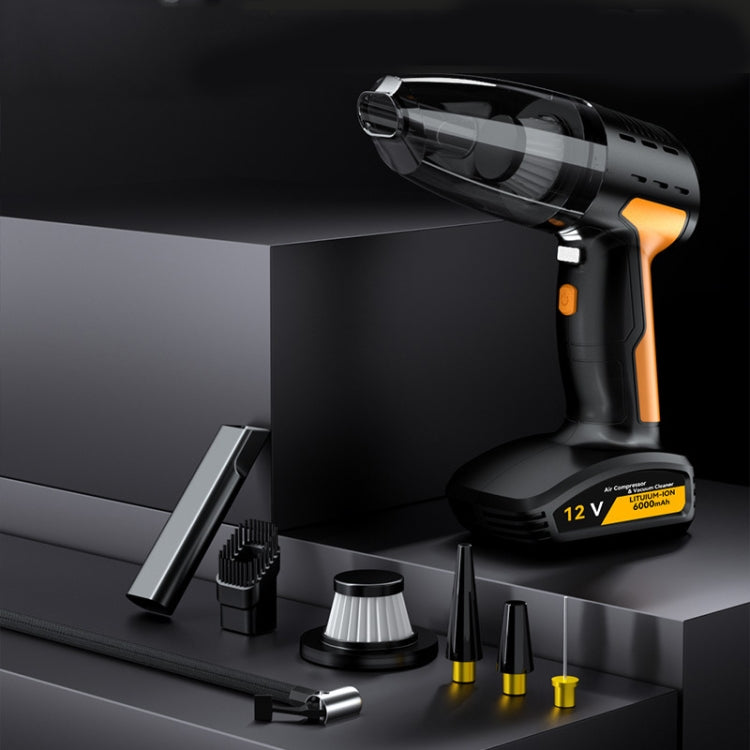 Cordless car vacuum cleaner with orange handle and black attachments on a tray