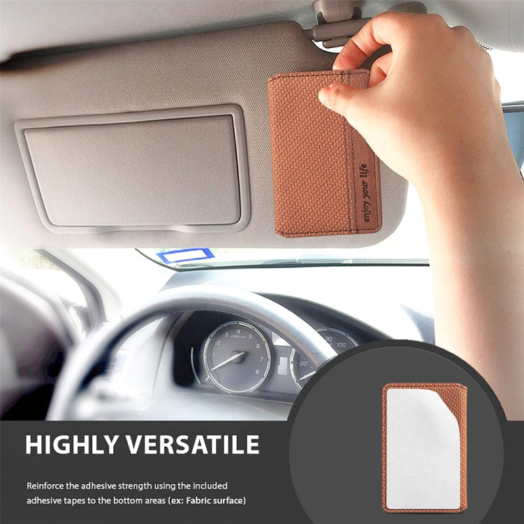 Brown textured adhesive phone card bag attached to car dashboard panel