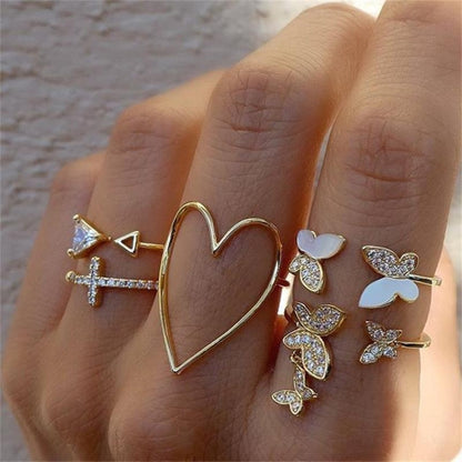 Gold-tone heart and butterfly openwork knuckle rings set of 5 on hand
