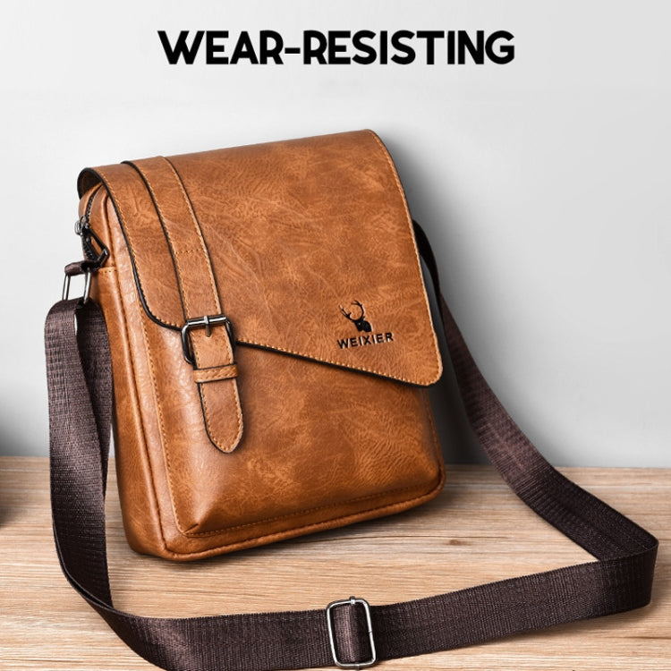 Light brown retro messenger bag with front flap, buckle closure, adjustable strap