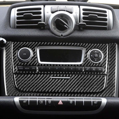 Carbon-fiber style CD panel sticker set with black finish for car dashboard controls