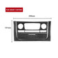 Black carbon-fiber dashboard trim insert with two round cutouts and center screen opening