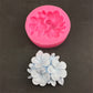 Pink silicone 3-petal flower mold with frangipani-style raised blossoms