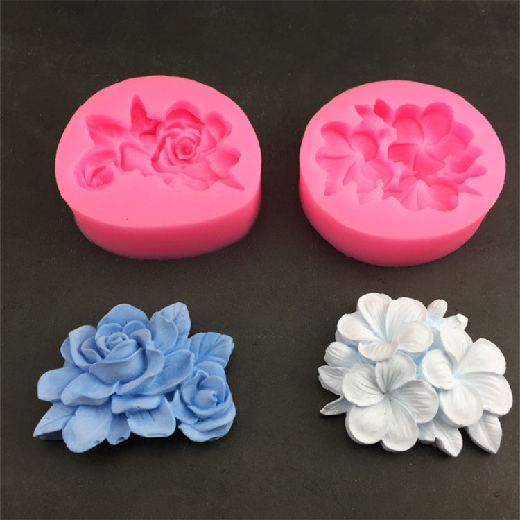 Two pink silicone 3-petal flower molds with raised gardenia and frangipani patterns