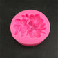 Pink silicone 3-petal flower mold close-up with raised gardenia-style blossom