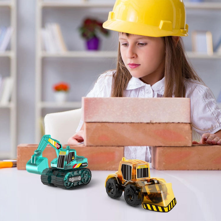 Child with teal and orange solar engineering vehicle toys on boxes during play