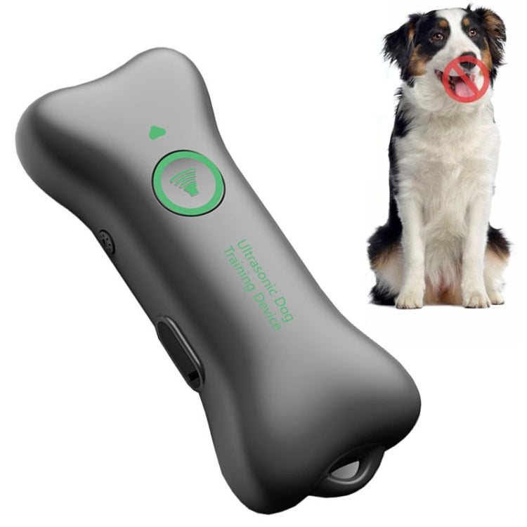 Handheld ultrasonic dog barking repellent device, dark gray with green indicator light