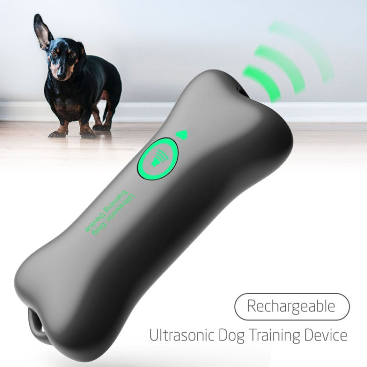 Ultrasonic dog training device with green sound indicator, dark gray handheld